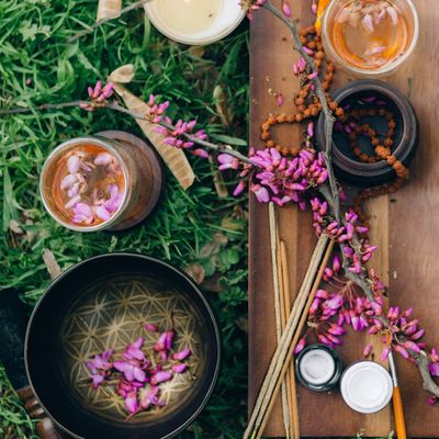 Portrait of Olga Zariczna, a smiling yoga instructor in a calm setting.
